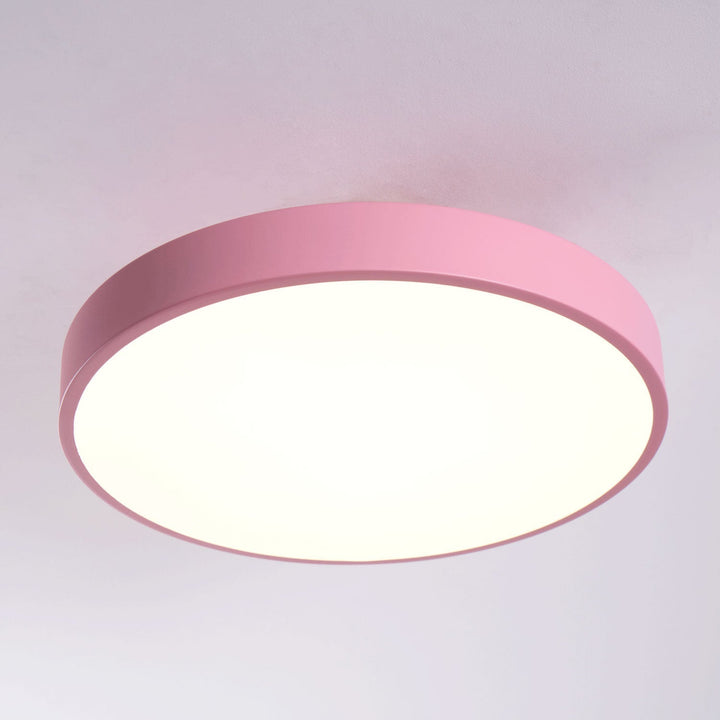 Stylish round LED flush mount, dimmable ceiling light for modern living spaces.