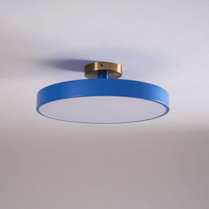 Modern bedroom LED round flush mount, warm light for relaxation.