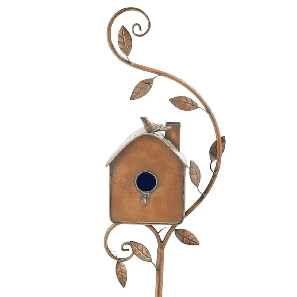 Outdoor decor: charming rustic birdhouse made of metal, perfect for small birds.