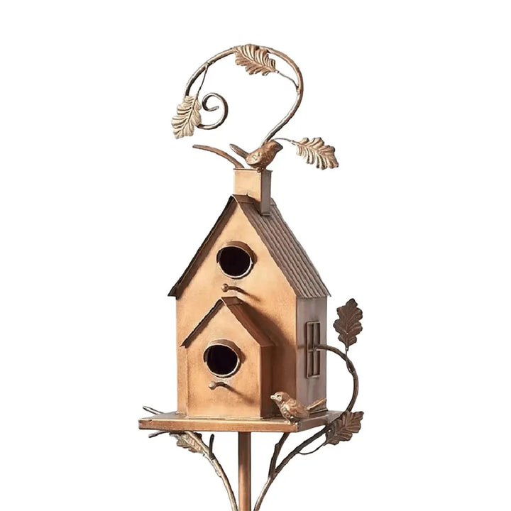 Dual entry metal birdhouse, ideal for garden decoration and bird nesting.