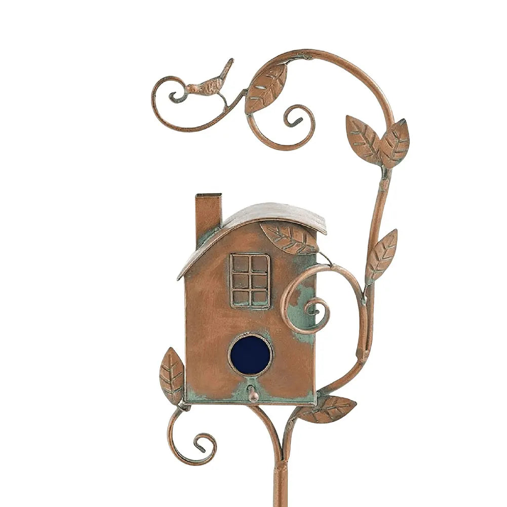 Decorative leaf design on a rustic copper finish metal birdhouse for wildlife.