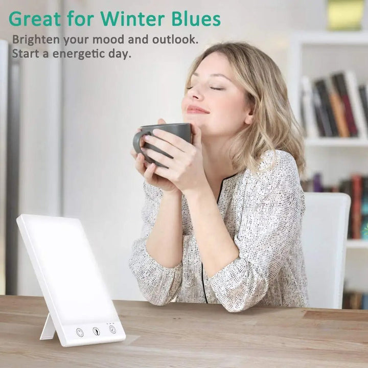 Portable SAD Therapy Lamp on a desk, emitting bright light for energy, focus, and combating seasonal mood changes.
