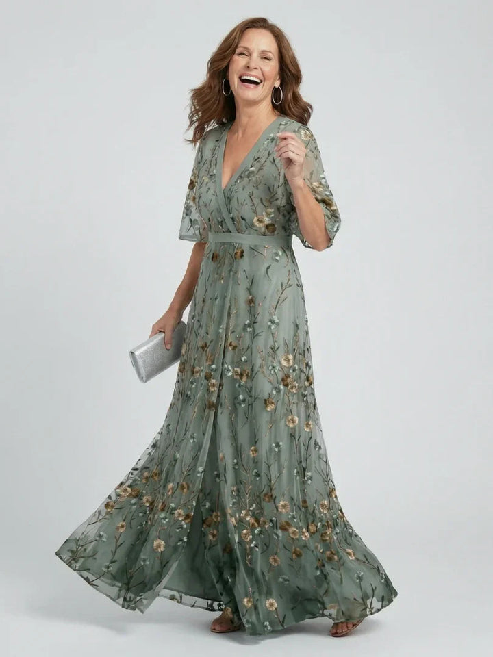 Sage green floral embroidered drop waist maxi dress for women, elegant v-neck & flutter sleeves, perfect for garden parties.