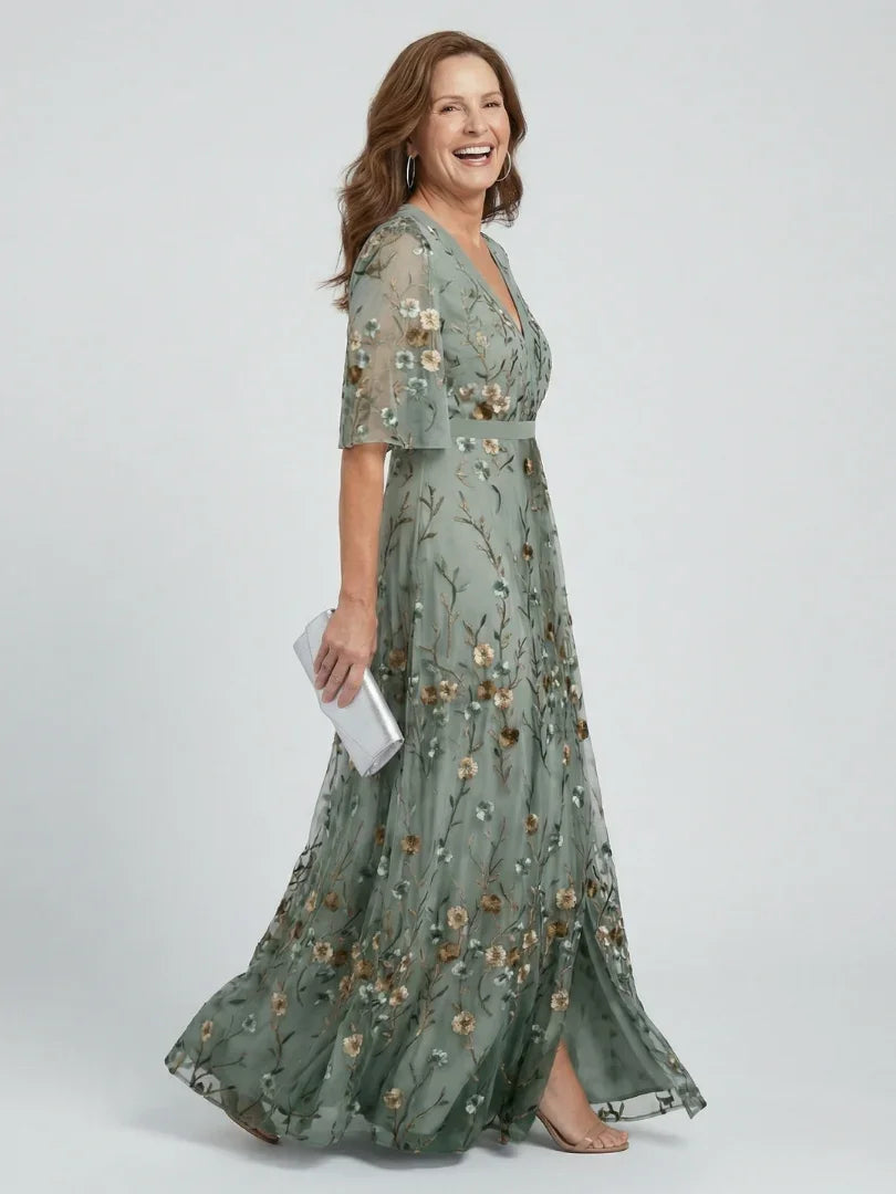 Women's sage green floral embroidered maxi dress with drop waist and flutter sleeves, ideal for summer wedding guests.