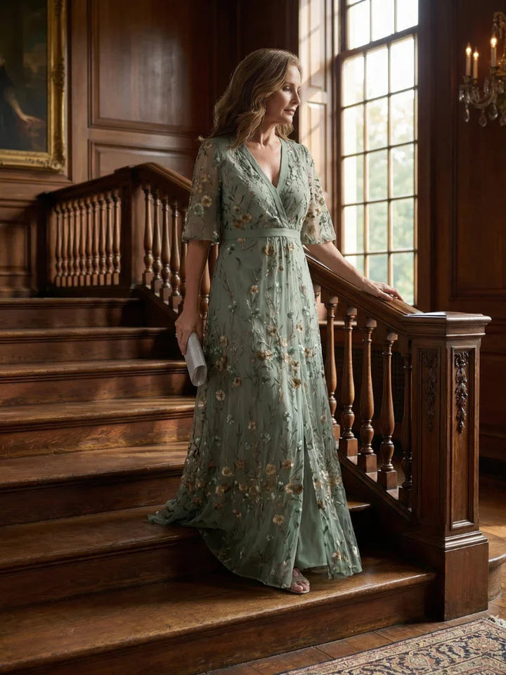 Beautiful women's sage green floral embroidered maxi dress with drop waist, flutter sleeves, suitable for evening events.