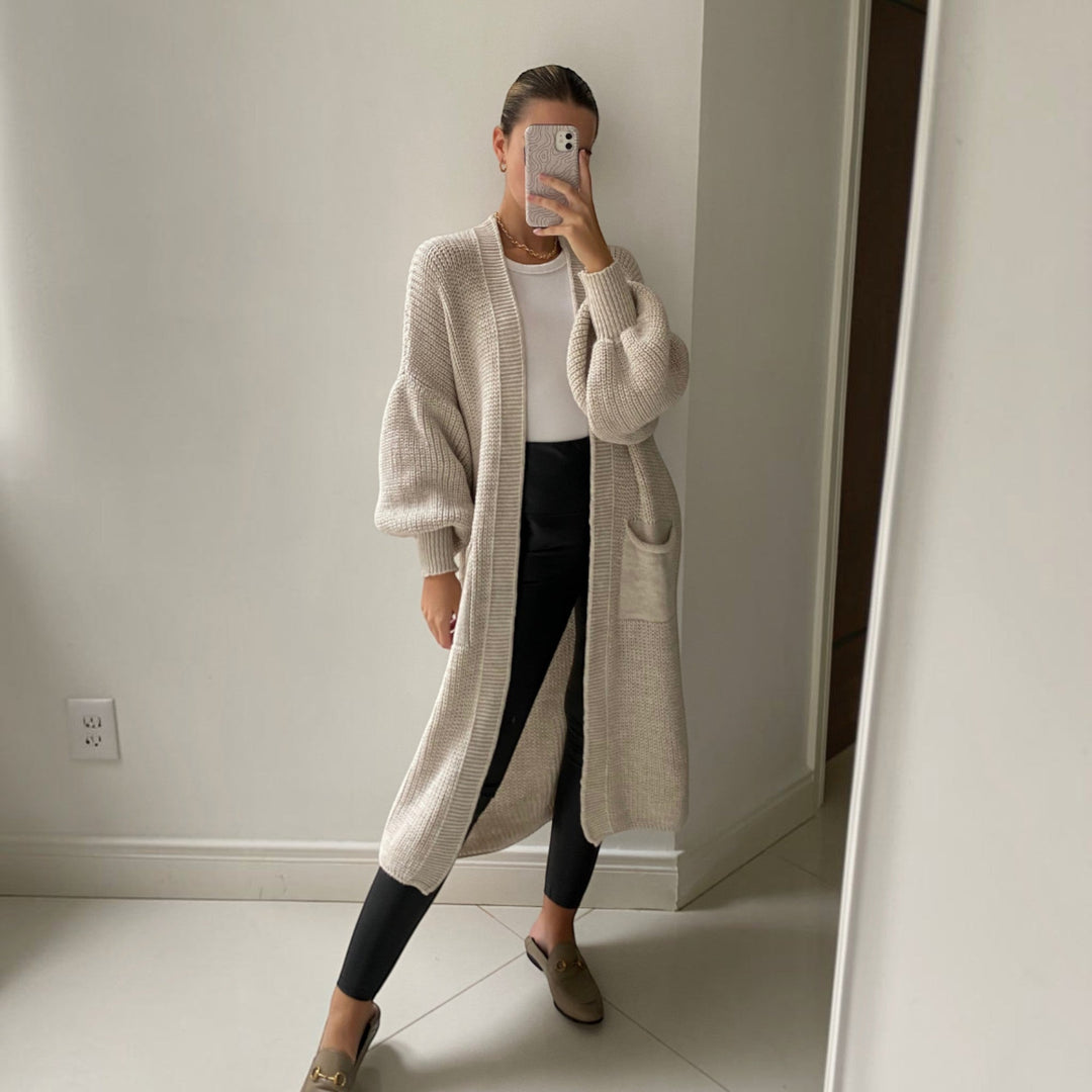 Elegant bell sleeve longline cardigan for women, soft knit in sand, versatile everyday fashion.