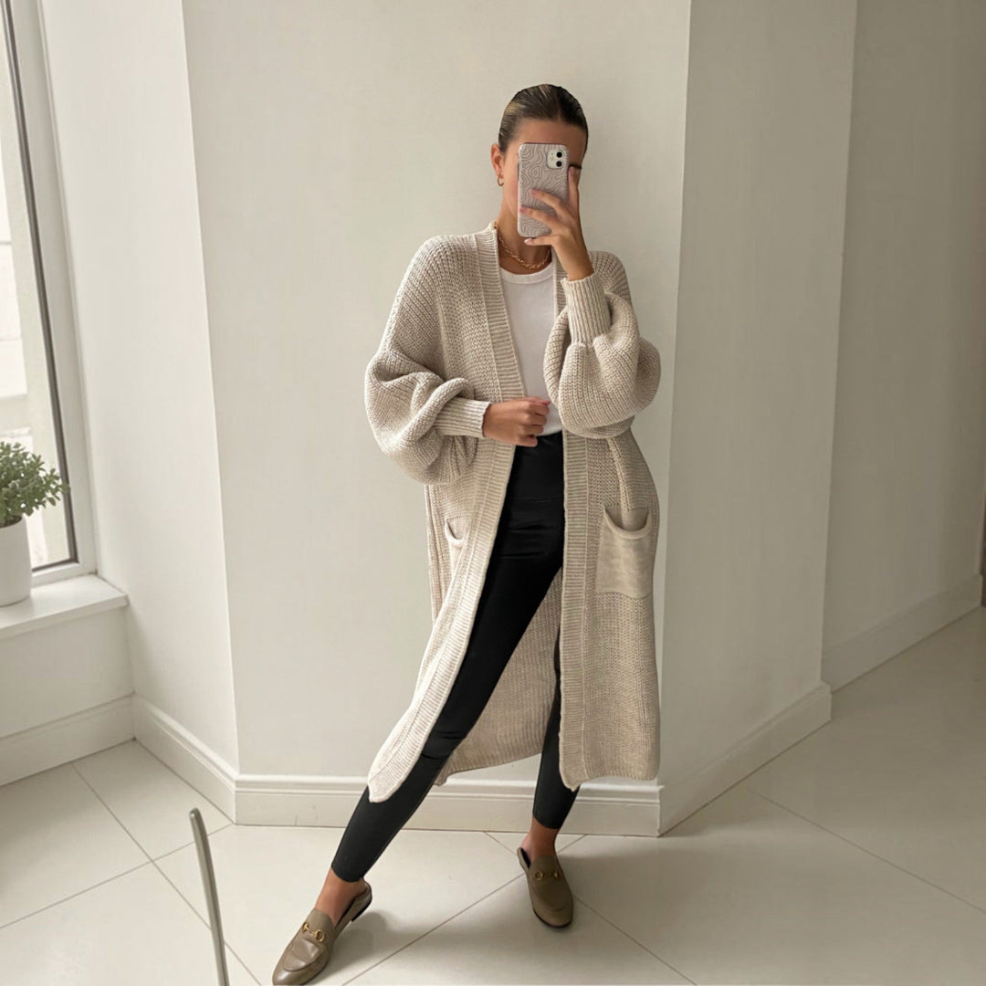 Comfortable soft knit women's longline cardigan in sand, ideal layering piece for effortless everyday style.
