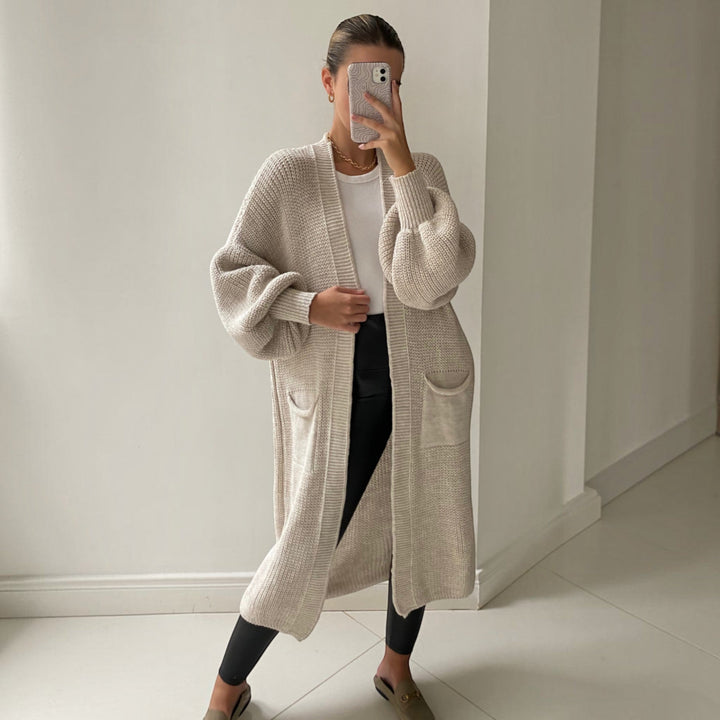 Effortlessly stylish women's soft knit longline cardigan in sand, perfect for elegant everyday comfort.