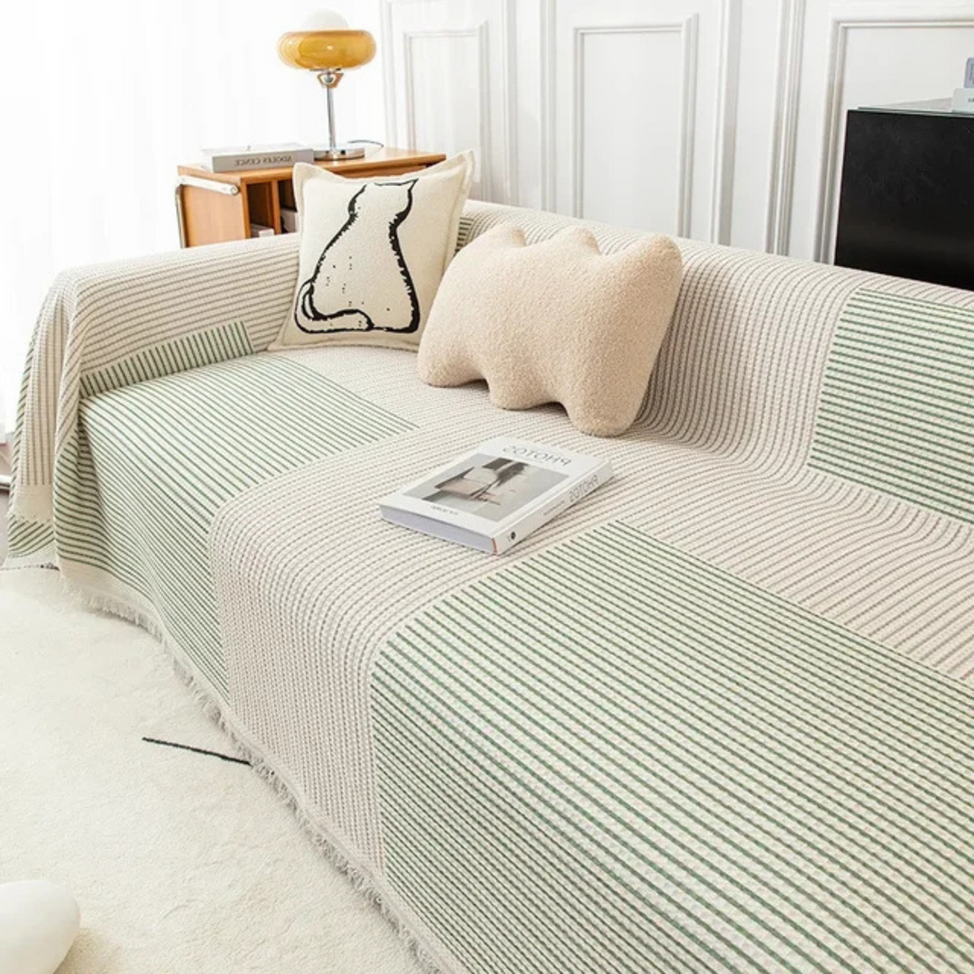 Scandinavian sofa throw blanket with decorative tassels. Perfect for cozy modern living room decor.