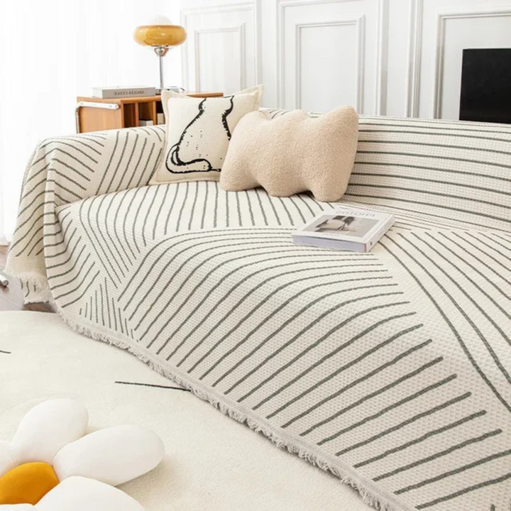 Modern patterned sofa blanket with tassels. Stylish decorative throw for any living room or furniture protector.