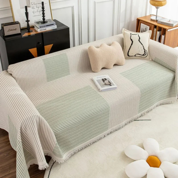 Luxurious Scandinavian sofa throw with tassels. A modern, cozy blanket and decorative home accent for living rooms.