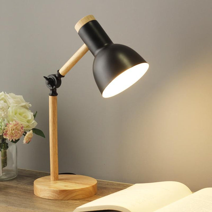 Modern Scandinavian wooden desk lamp, adjustable and foldable, perfect for an office or study table.