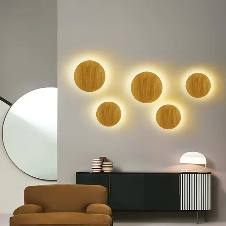 Minimalist Scandinavian wooden LED wall light providing warm, ambient light for bedroom or living room.