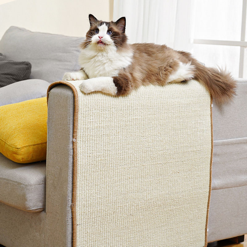 Scratchify furniture-saving cat scratch mat protecting a cream sofa armrest