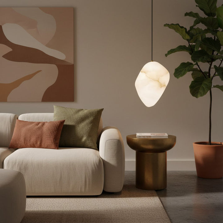 Decorative ceiling lamp: sculptural pebble pendant with elegant brass finish for modern homes.
