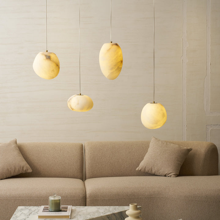 Elegant brass pebble pendant light, a modern ceiling lamp for ambient home decor.