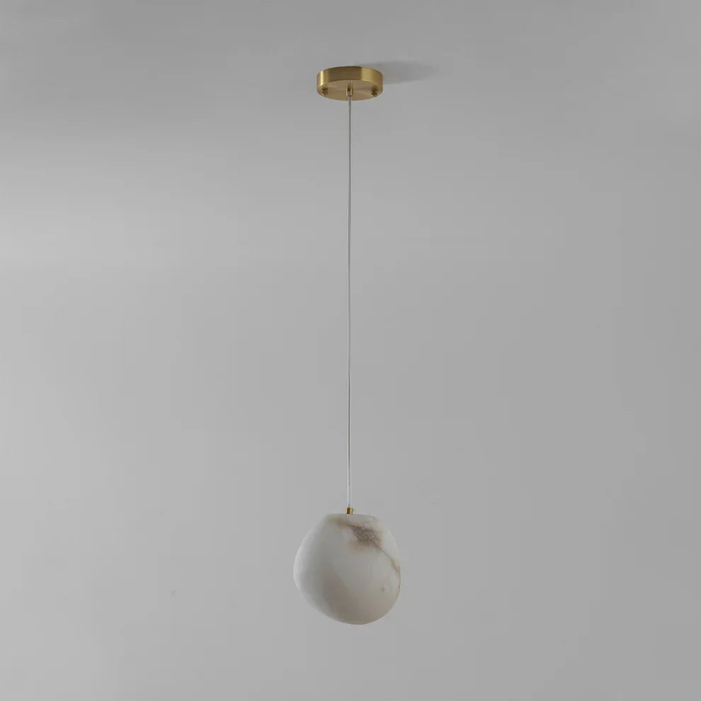 Ambient lighting solution: brass sculptural pebble pendant light, modern decorative fixture.