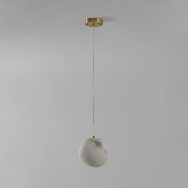Ambient lighting solution: brass sculptural pebble pendant light, modern decorative fixture.