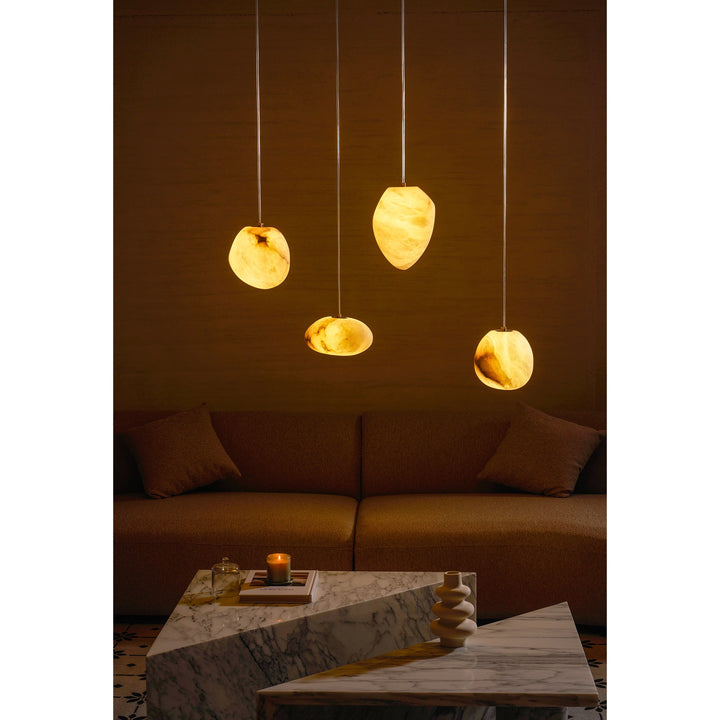 Decorative brass pebble pendant lamp, sculptural design, ideal for serene living spaces.