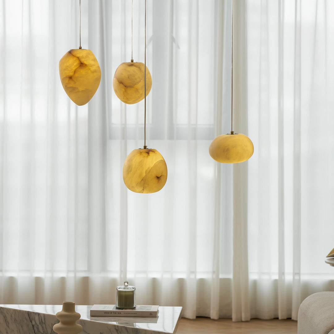 Unique sculptural pendant light featuring a brass finish, ideal for classic Japandi interiors.