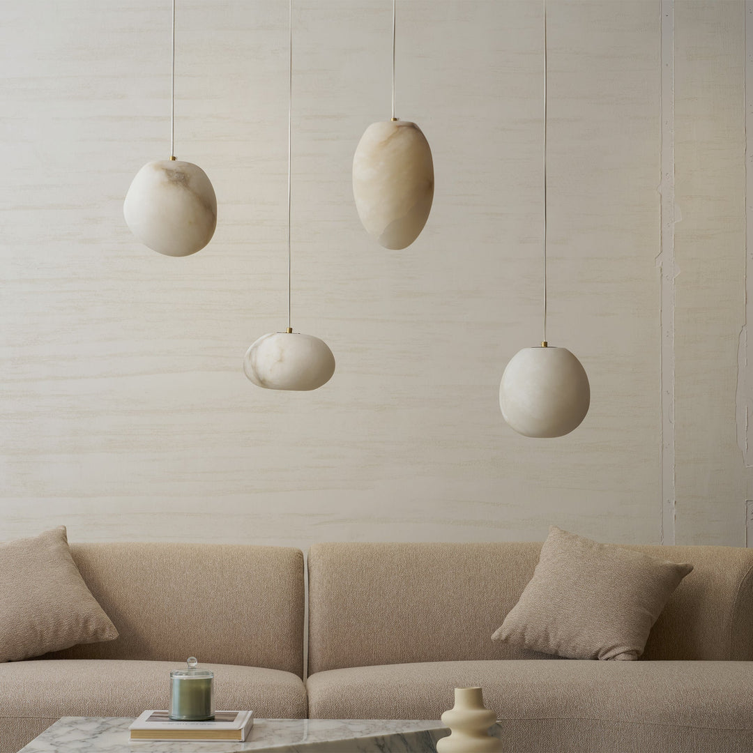 Brass sculptural pebble pendant light, a modern and elegant ceiling lamp for home decor.