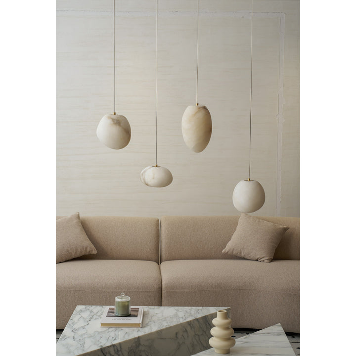 Unique pebble design pendant light, brass finish, sculptural, perfect for ambient serenity.