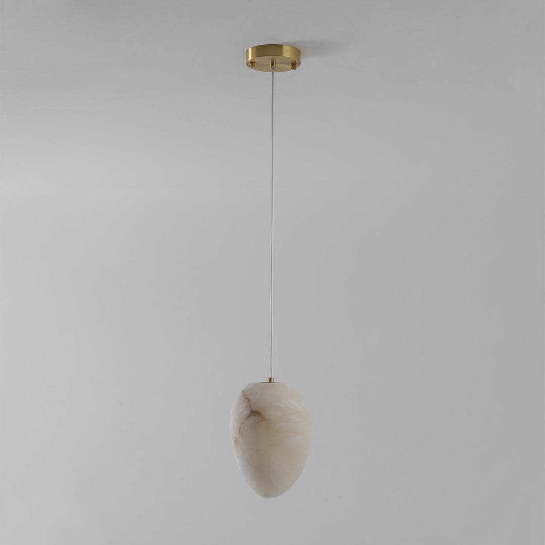 Decorative pendant lamp, brass finish, sculptural pebble, for ambient and modern home lighting.