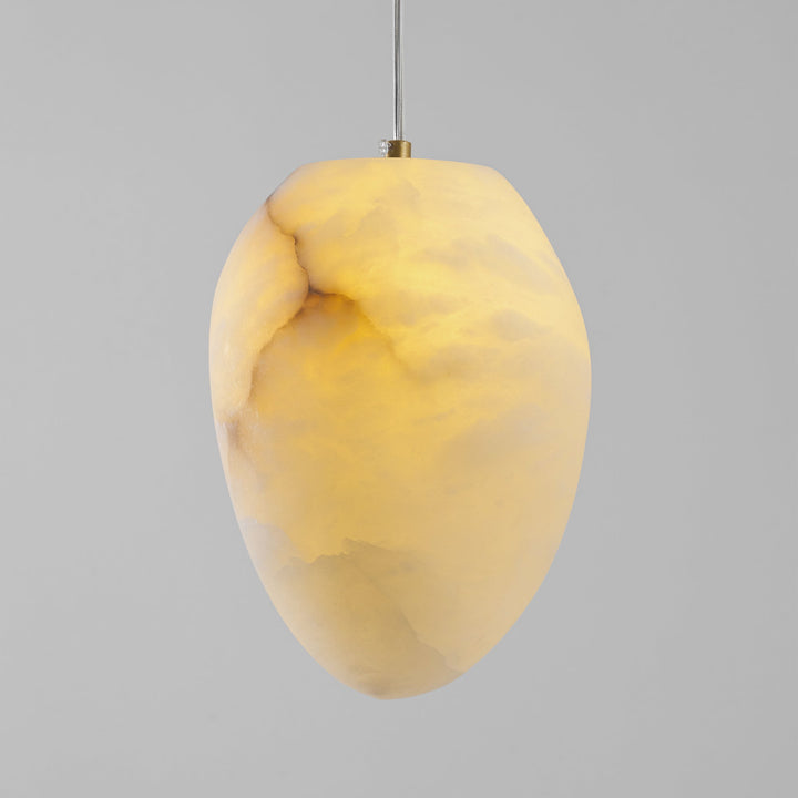 Serene home decor: sculptural pebble pendant light, brass finish, a Japandi style ceiling lamp.