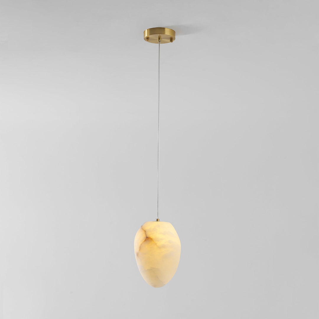 Brass finish sculptural pebble pendant light, modern ambient lighting for sophisticated spaces.