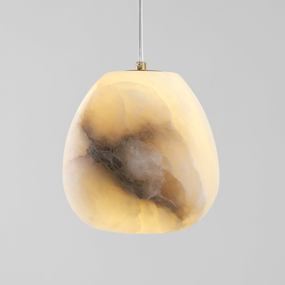 Unique brass sculptural pebble pendant light, ambient and modern for any home decor.