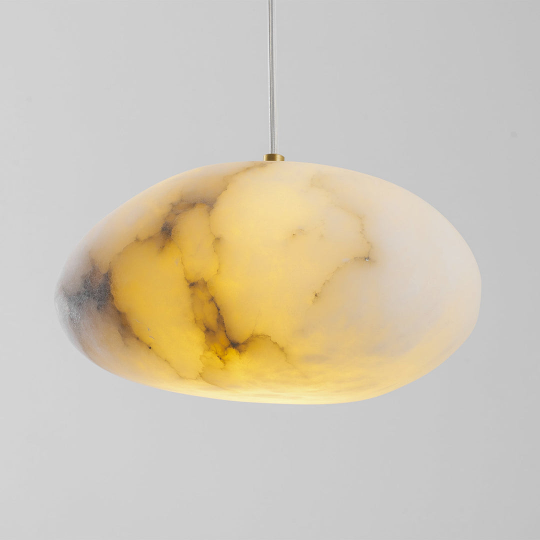 Ambient lighting: modern brass sculptural pebble pendant for decorative and serene spaces.