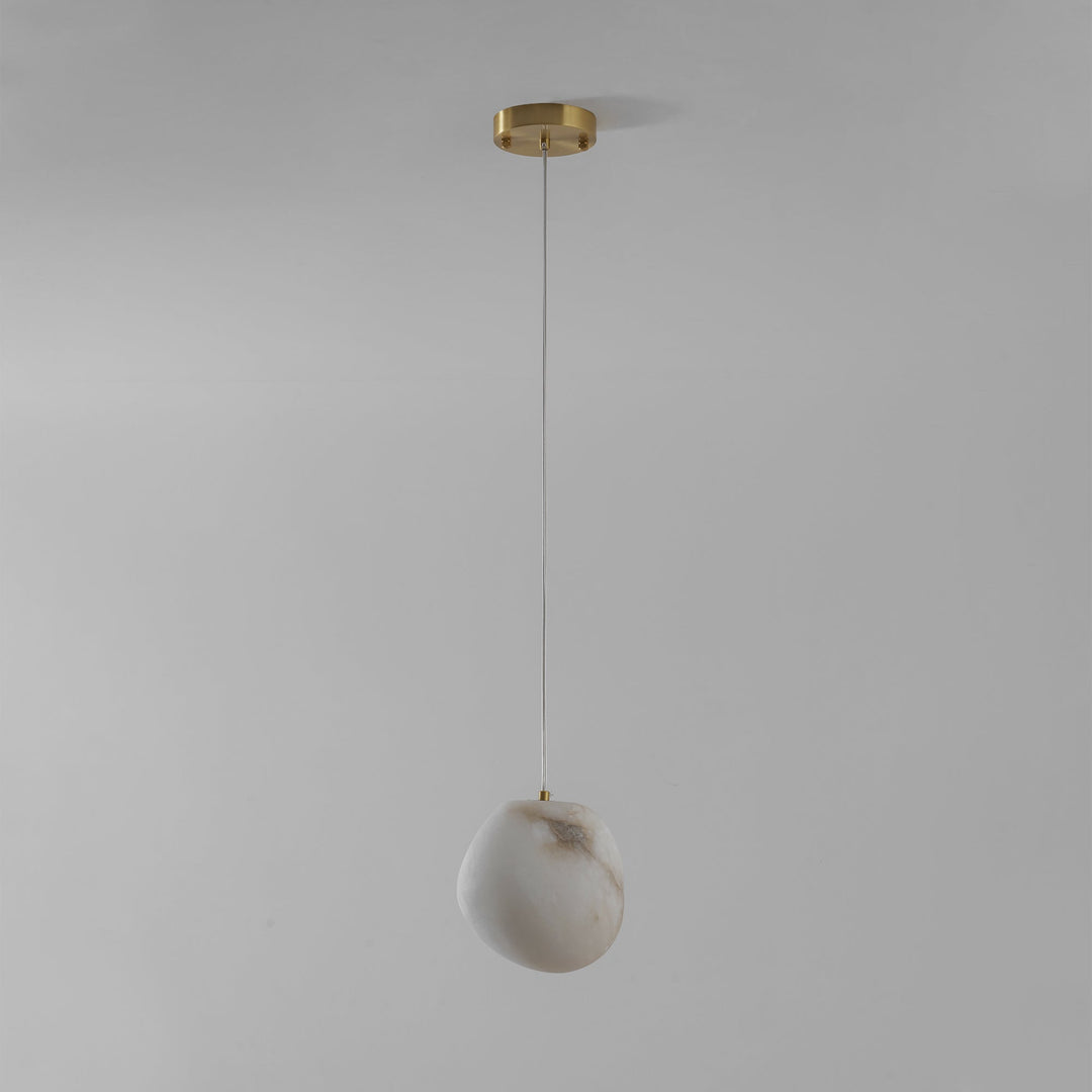 Japandi style brass finish sculptural pebble pendant light, elegant and timeless home decor.