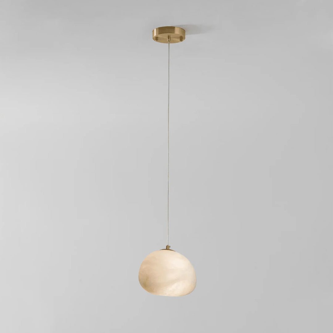 Brass pebble pendant light, sculptural design, a modern ambient lighting solution for homes.