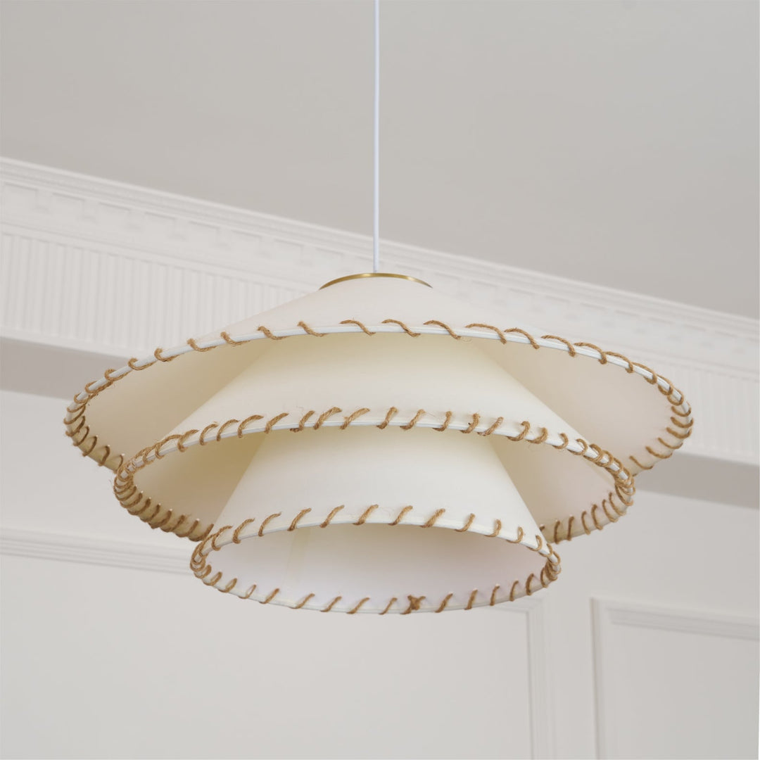 Sculptural tiered pendant light, warm beige, ambient glow for stylish home decor.