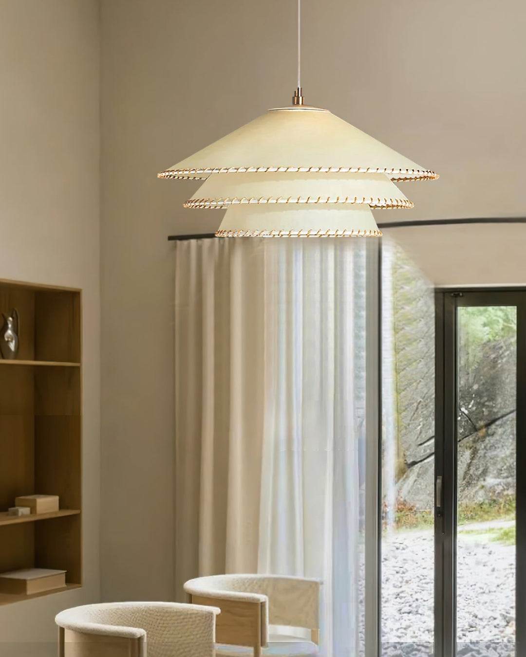 Sculptural tiered pendant light, beige, ambient glow for contemporary entryway.