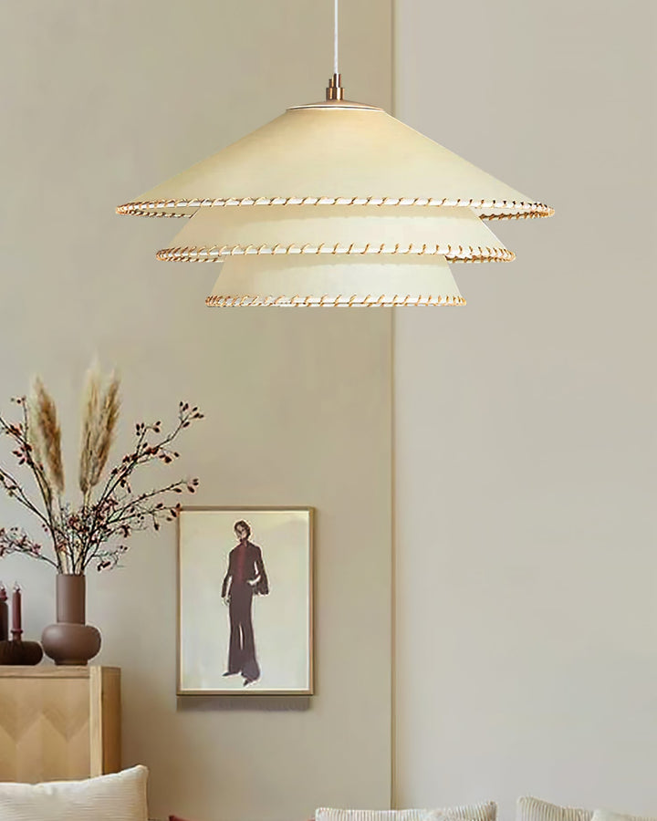 Home decor pendant light, sculptural tiered design, warm neutrals, ambient glow.