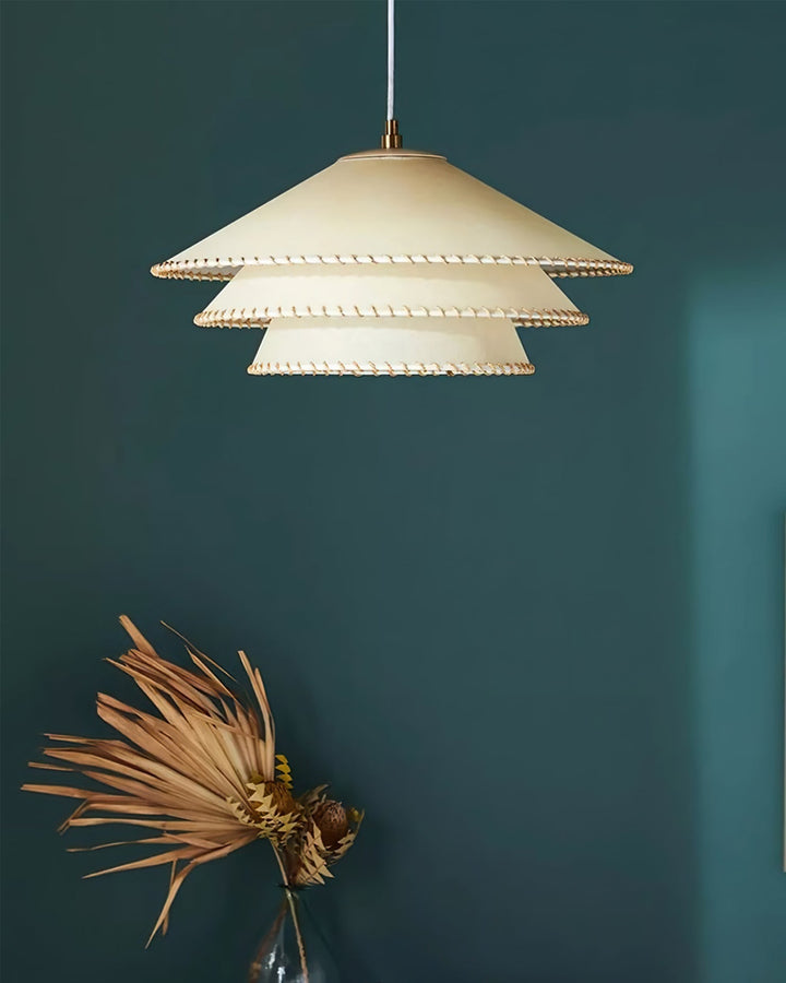 Dining room ceiling lamp, sculptural tiered, beige, ambient lighting fixture.