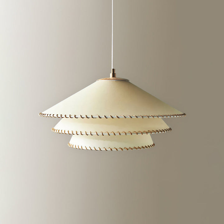 Entryway pendant lamp, tiered sculptural design, beige, inviting ambient light.