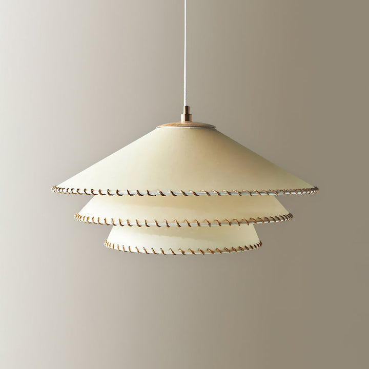 Sculptural tiered pendant, warm neutral beige, ambient glow, ideal for modern spaces.