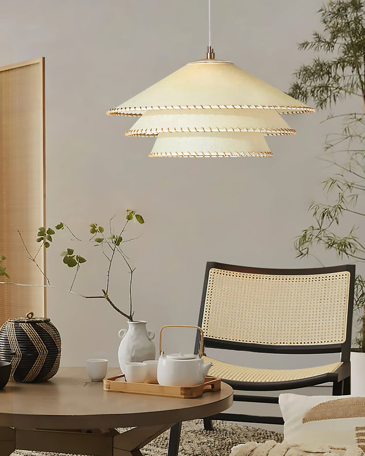 Ambient glow pendant light, sculptural tiered design, warm neutral beige, home decor.