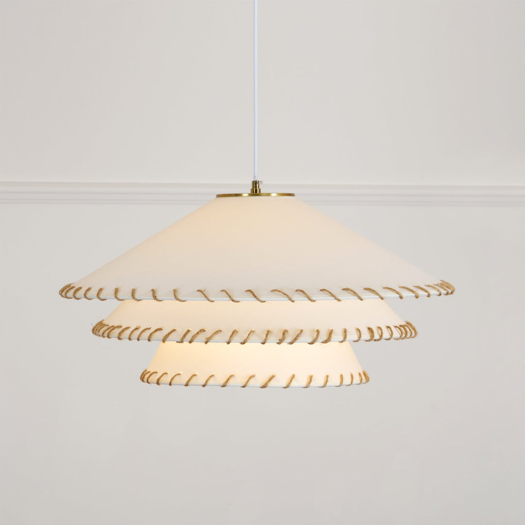 Dining room pendant light, sculptural tiered, warm neutrals, ambient glow, modern decor.