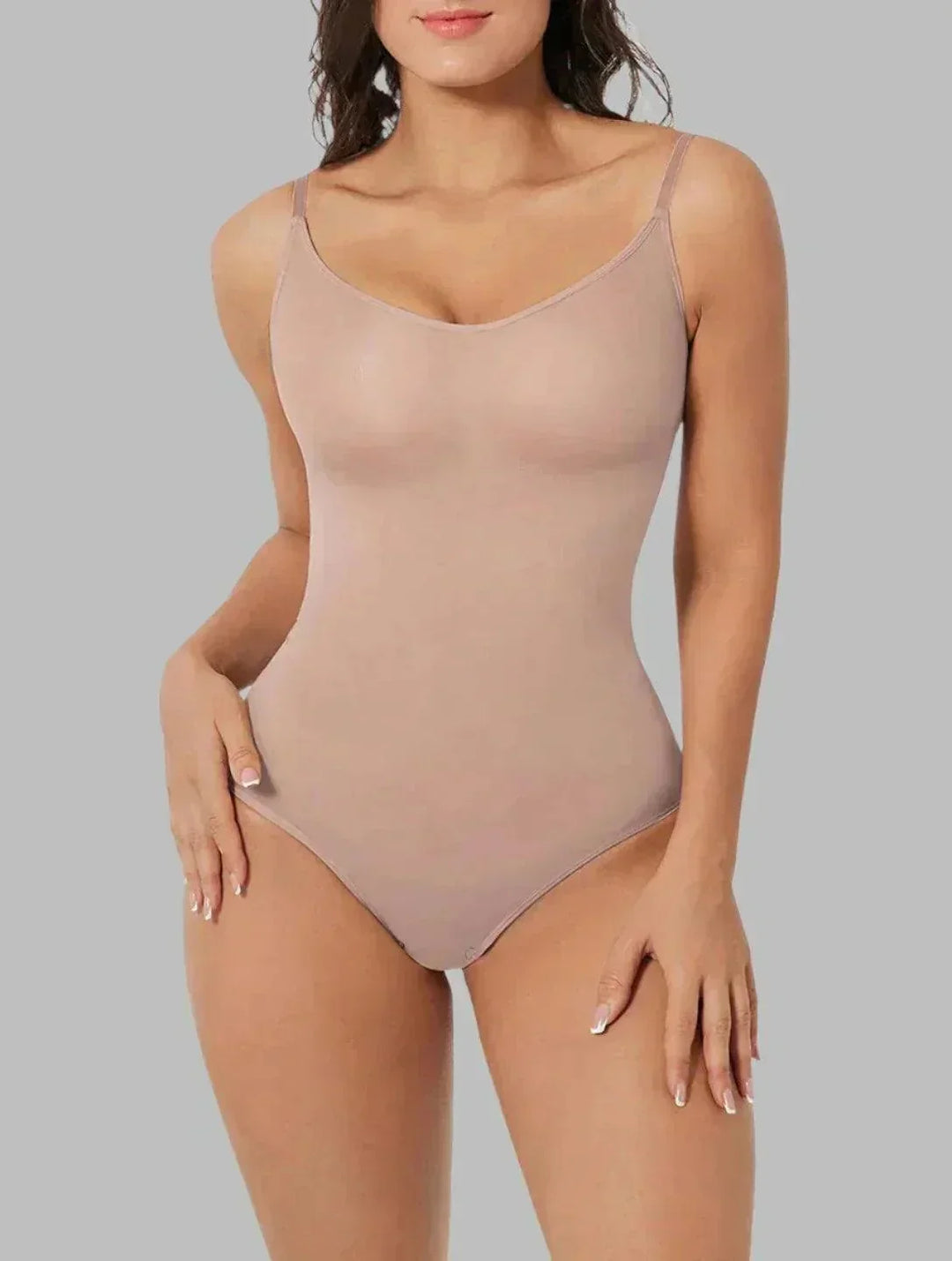 Smooth your figure with this seamless women's shapewear bodysuit, providing tummy control & lift.