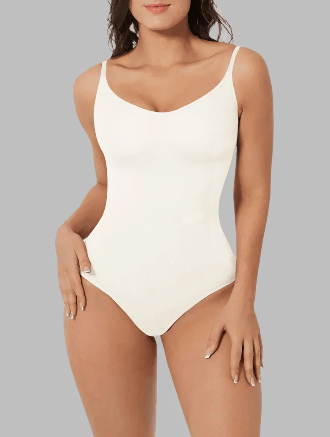 Achieve a defined look with this seamless women's bodysuit, offering tummy control & all-day comfort.