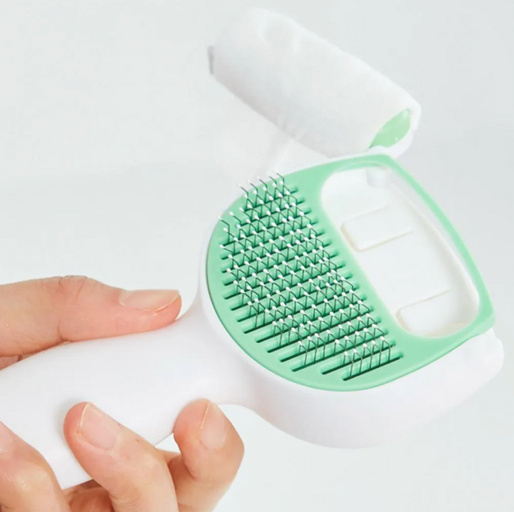 Durable self-cleaning brush for dog & cat grooming, ensuring easy hair removal & pet care.