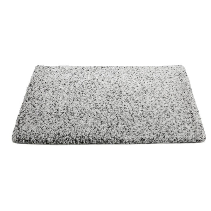 Gray self-heating pet mat, an electric-free dog bed for portable pet comfort.