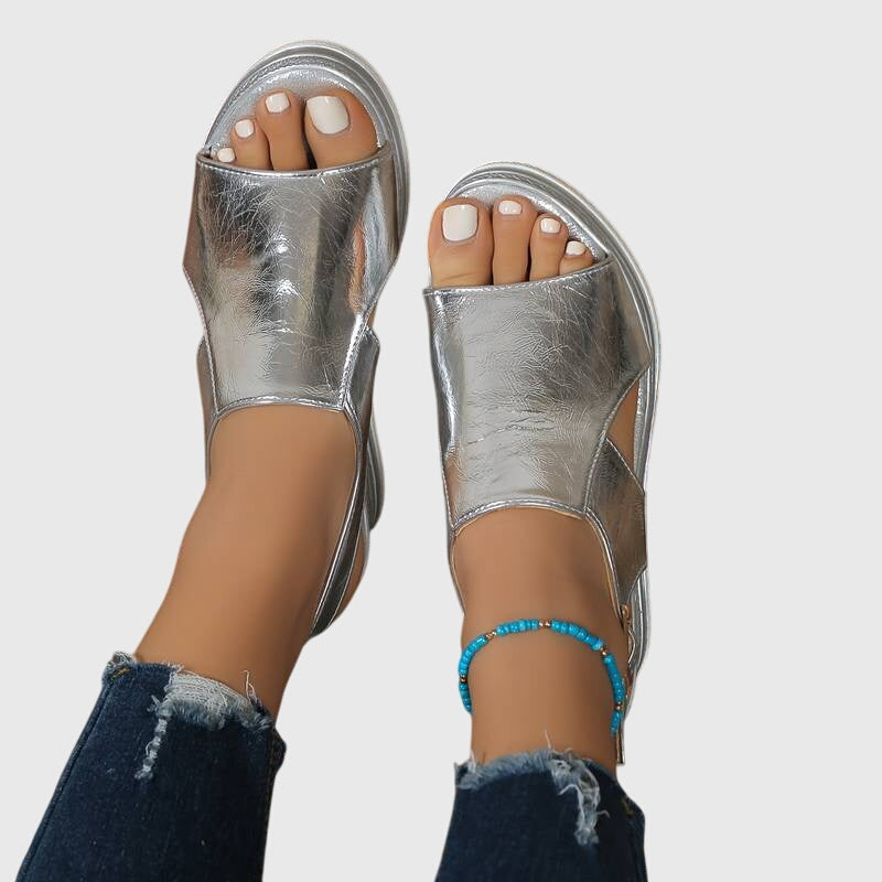 Silver shiny orthopedic women's sandals for ultimate comfort. Supportive, elegant, slip-resistant summer footwear fashion.