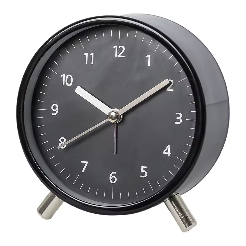 Close-up of a silent table clock with a clean, minimalist Scandinavian design.