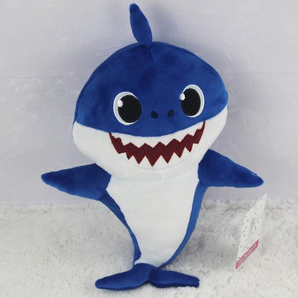 Iconic Baby Shark soft plush toy for kids. This singing stuffed animal plays music for interactive fun & cuddles.