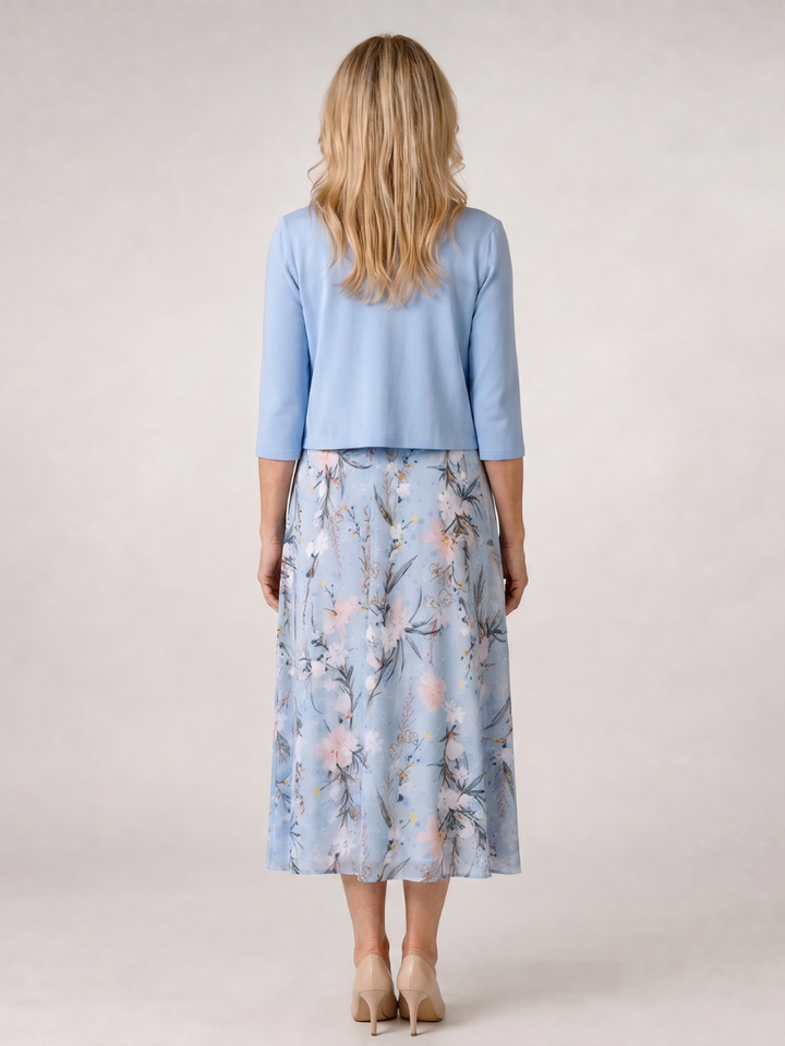 Vibrant floral print sleeveless midi dress & cropped jacket. Women's stylish two-piece set, great for spring/summer fashion.