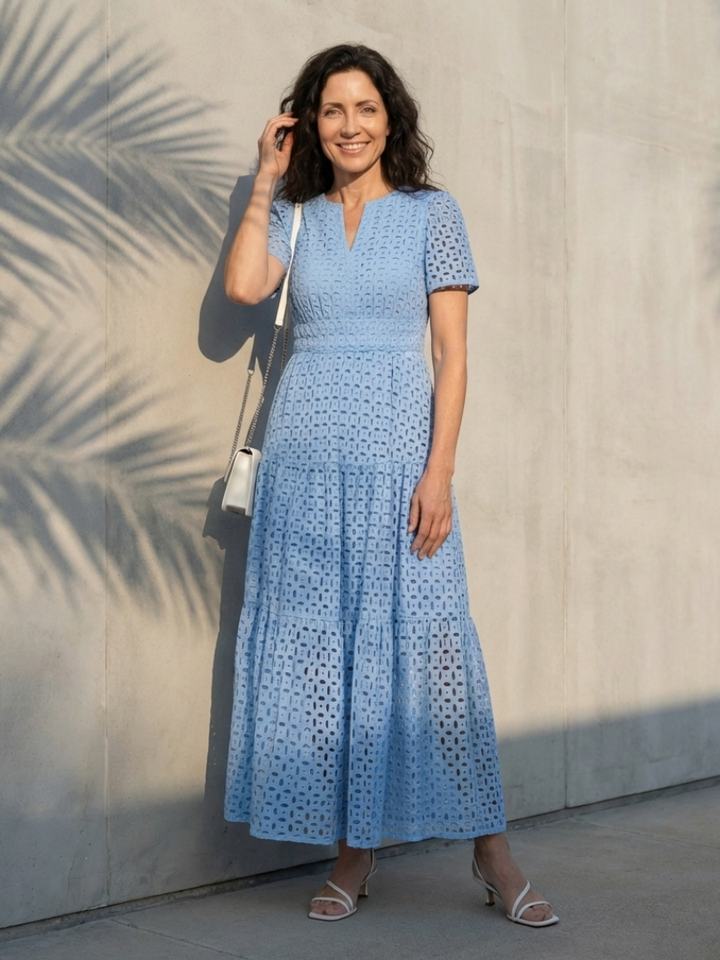 Women's sky blue V-neck short sleeve tiered midi dress with smocked waist, an elegant summer casual.